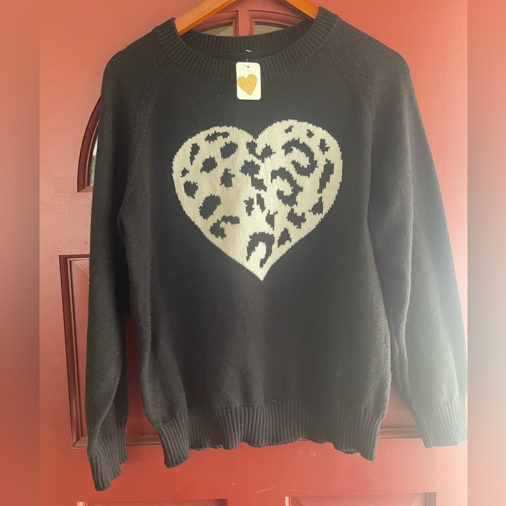 NWT long sleeve black sweater with heart 💜 design.